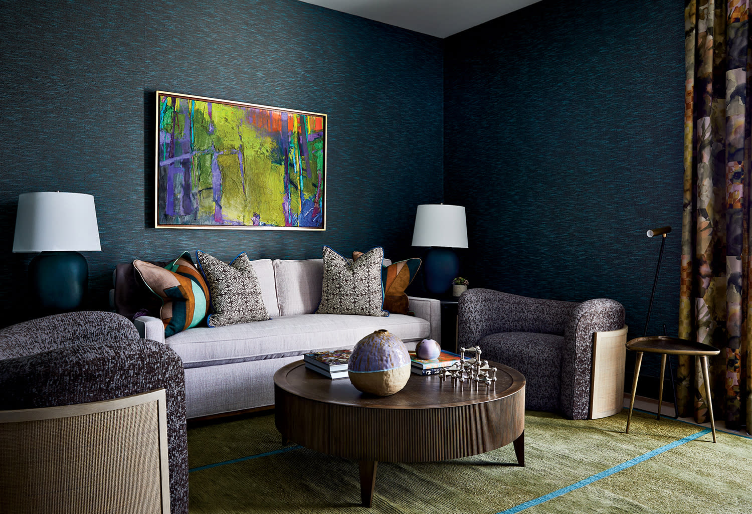 family room with a textural blue wallcovering and comfortable furnishings