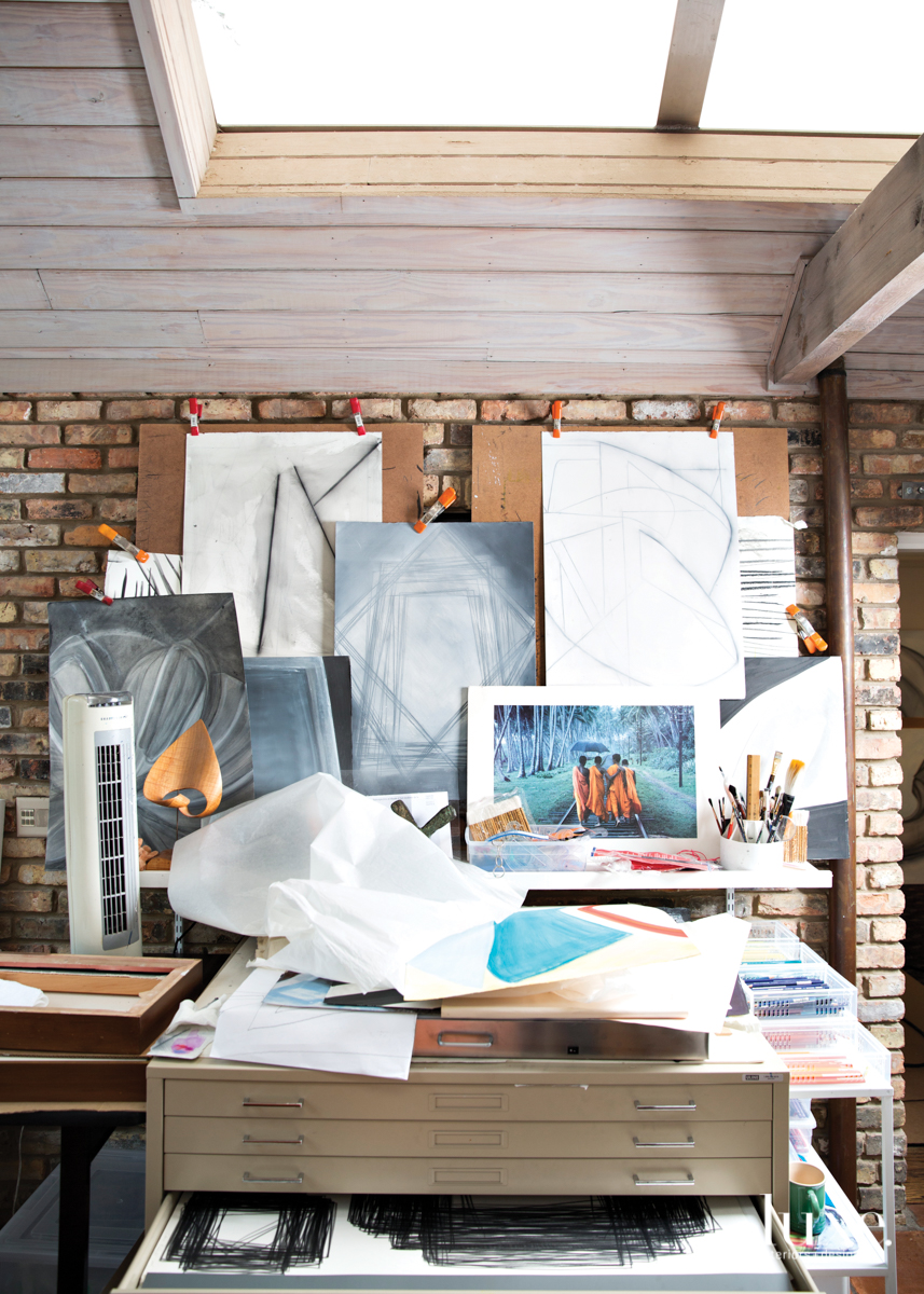 A flat-file cabinet in her studio stores hundreds of completed drawings.