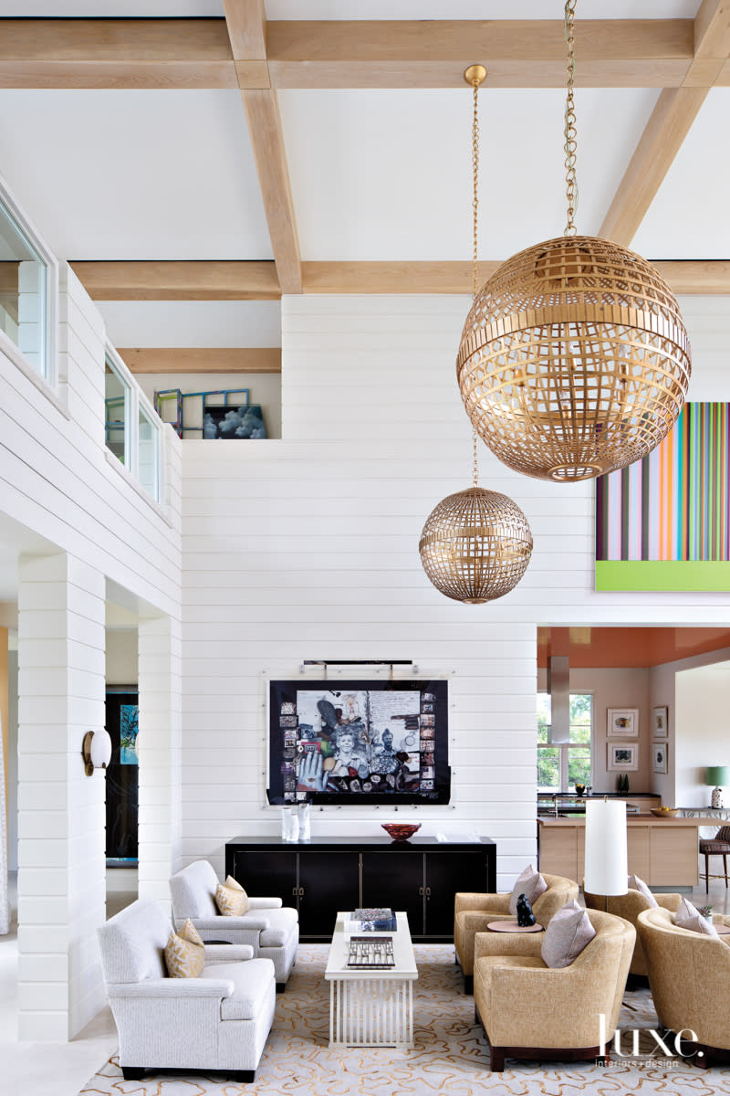 white living room with globe lights and coffee table in home by Peter Moor