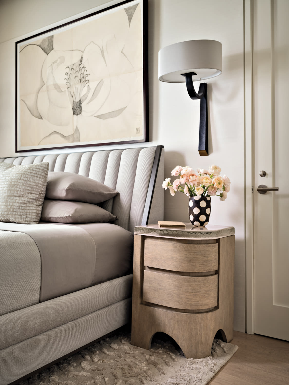 soft, contemporary bedroom with a gray upholstered bed 