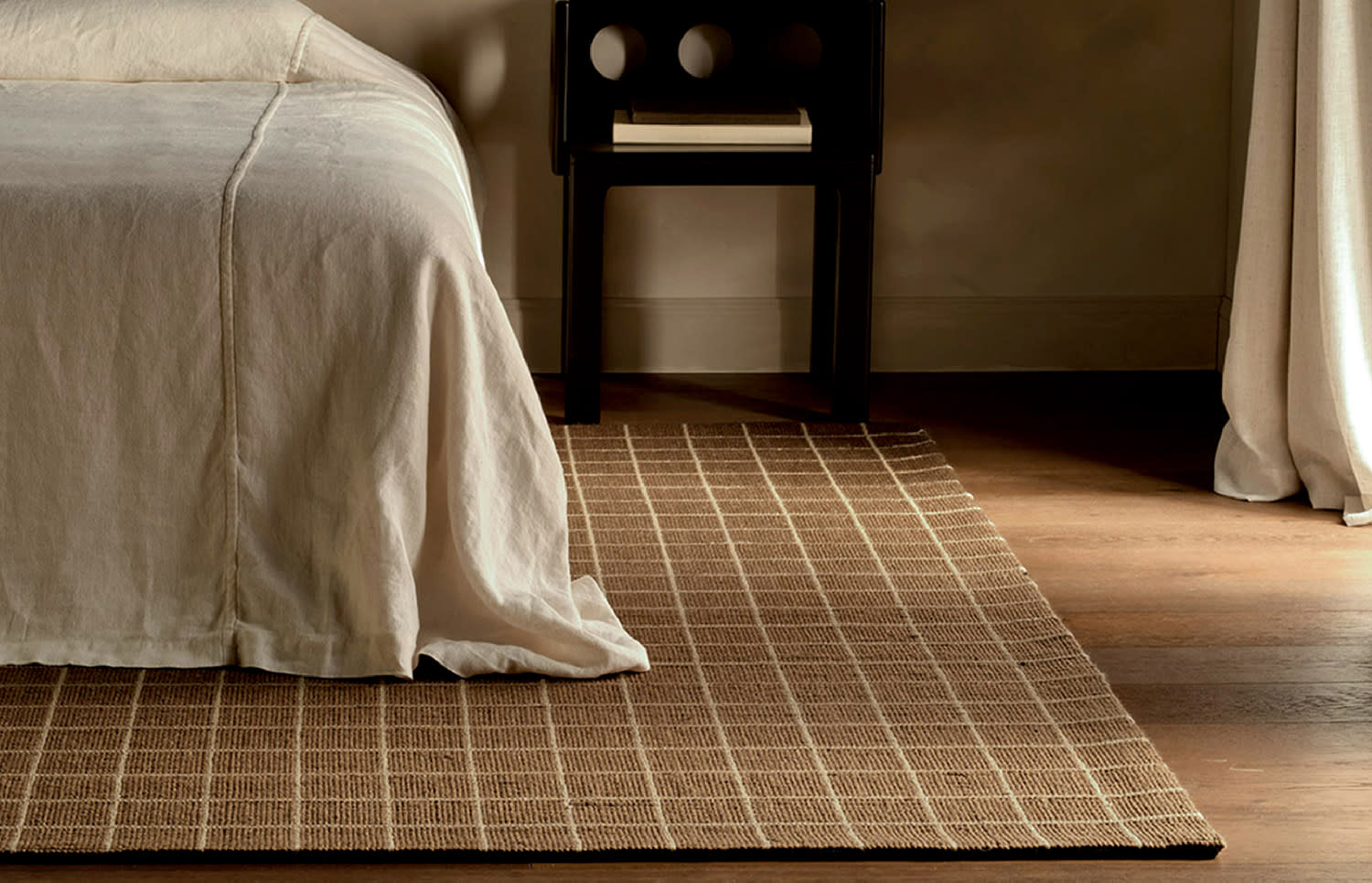 a brown and white striped rug made of sustainable materials