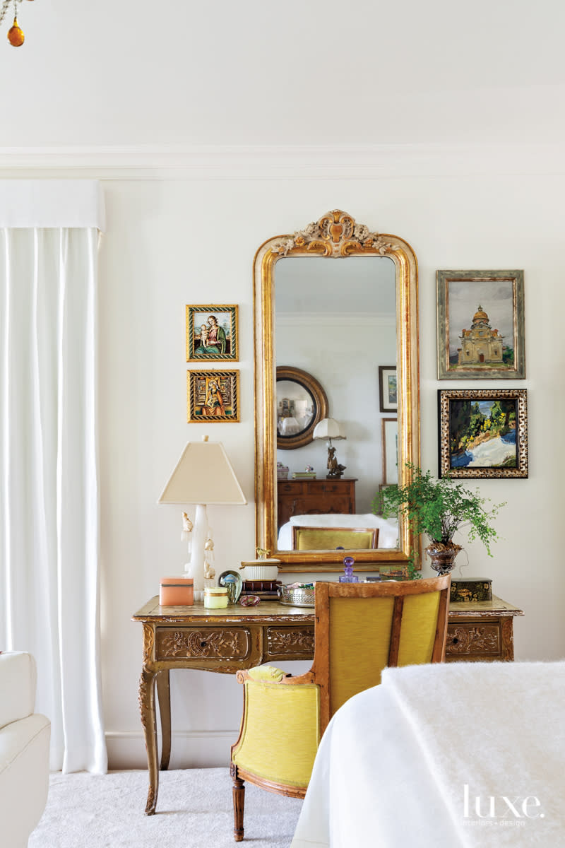 master bedroom with antique ladies desk and vintage barrel-back chair