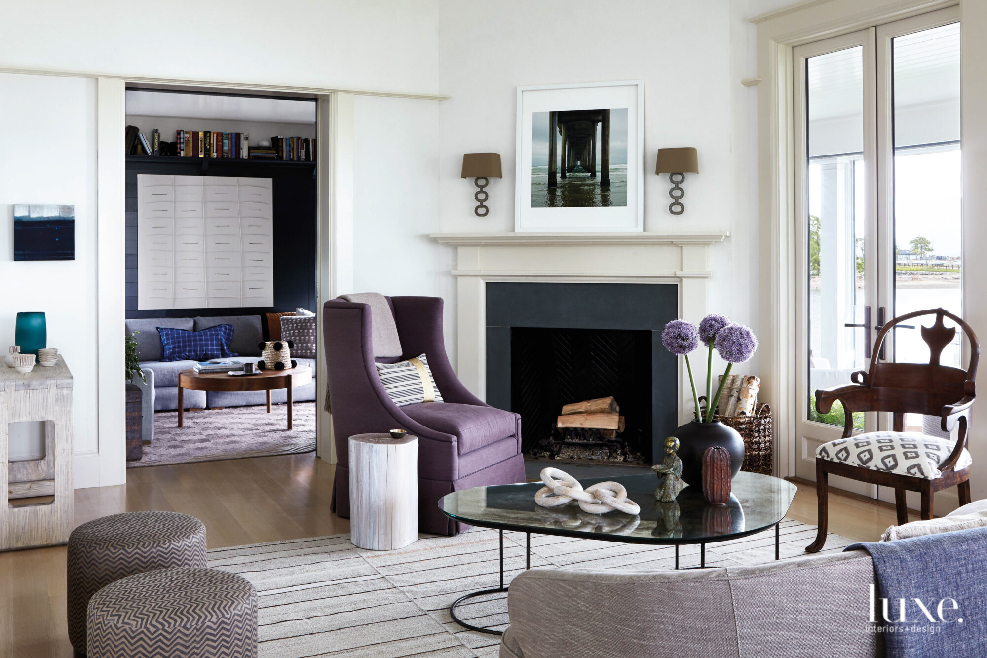 open flow living room with curved sofa and mirrored coffee table