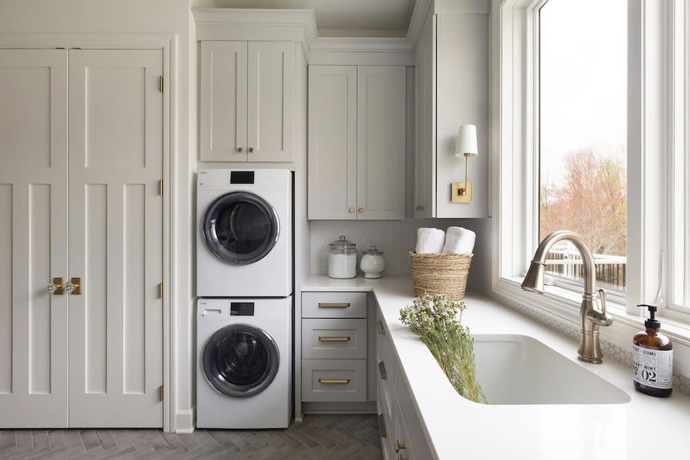 Laundry and mudroom with extra storage and plenty of counter space. 