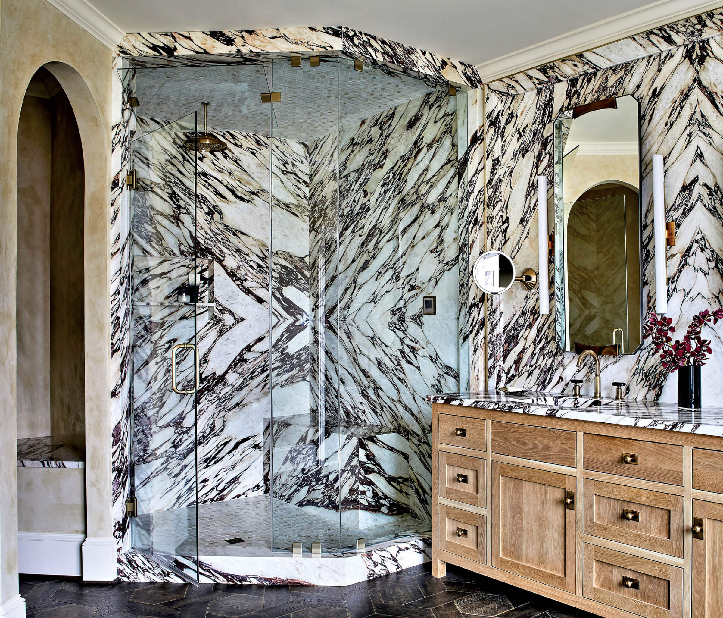 modern bathroom with Calacatta Vagli Viola marble lining the shower and the backsplash