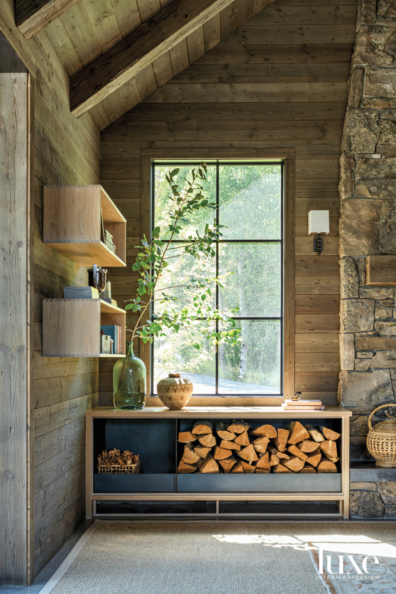 Corner of a living room with cabinet holding wood