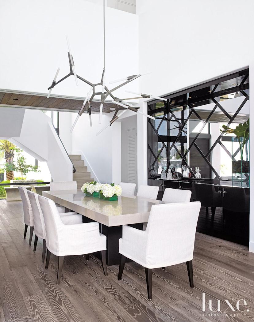 Modern Dining Room with Black Lacquered Bar | Luxe Interiors + Design