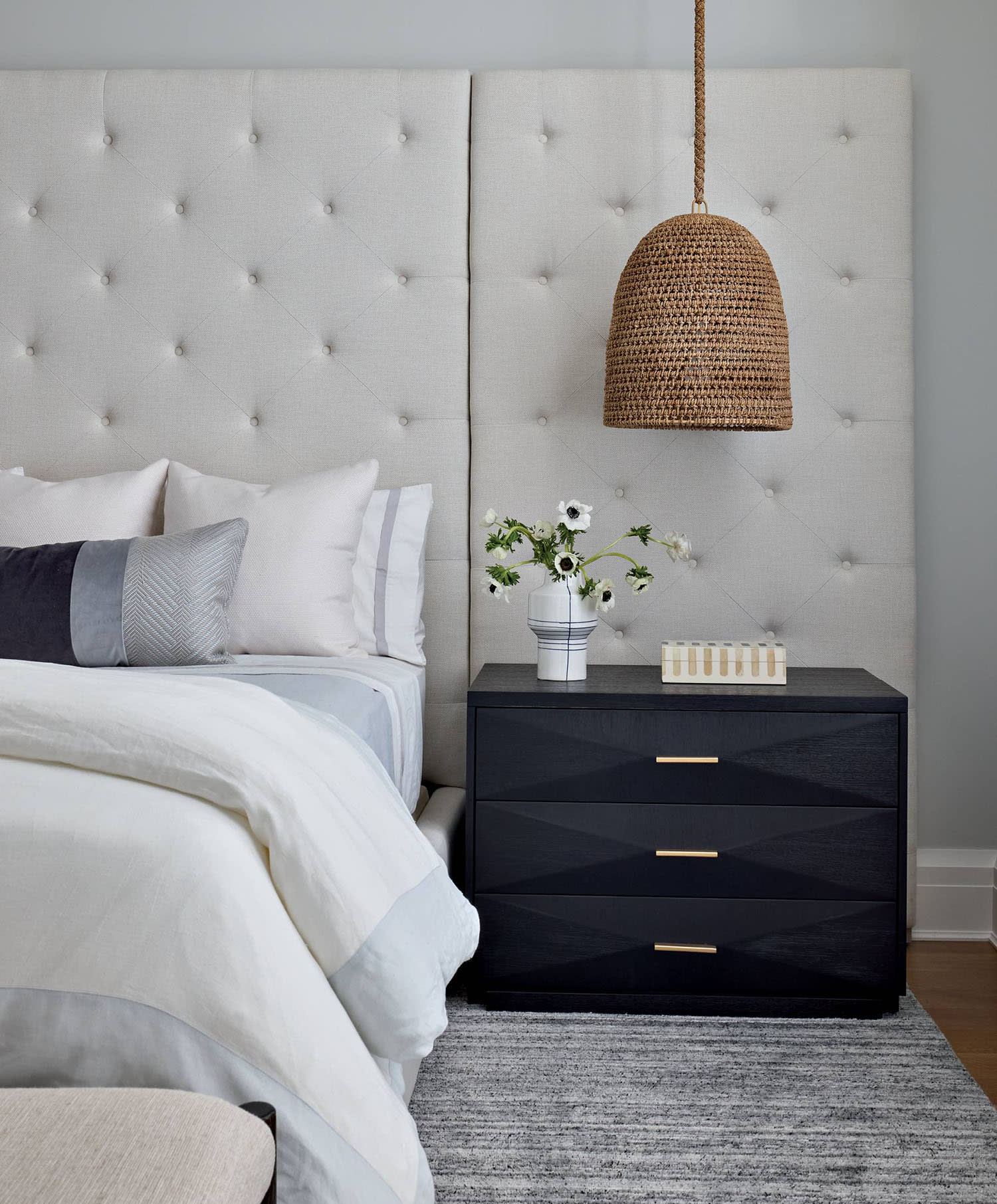 traditional bedroom with a tufted headboard