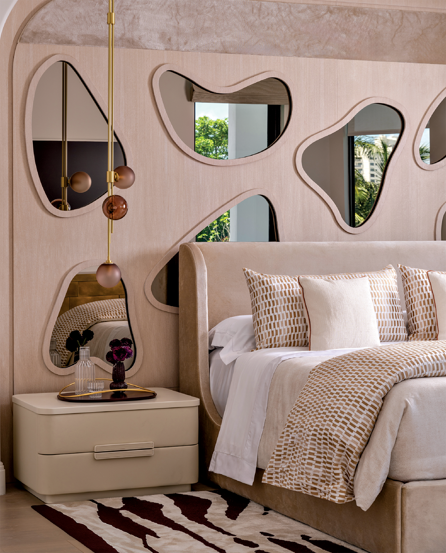 modern bedroom with organically shaped silver mirror insets among Dedar’s silk-velvet Splendido