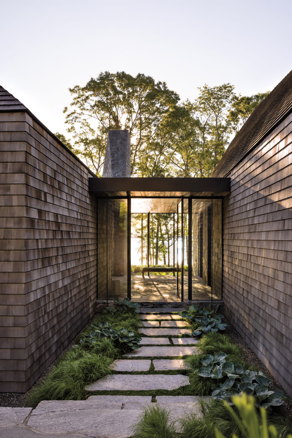 stepping stone pathway leading to the glass entryway of a Sag Harbor home