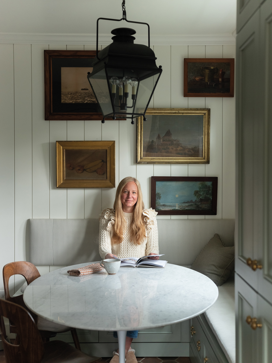 Heidi Caillier sitting at round table