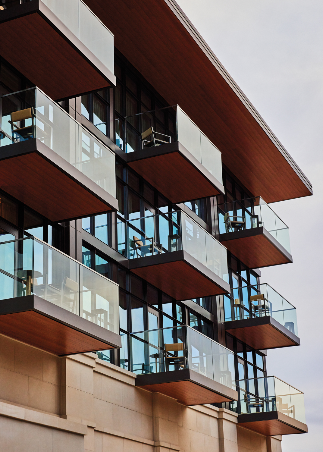 Exterior of Bowie House hotel building with floor-to-ceiling windows and cantilevered balconies