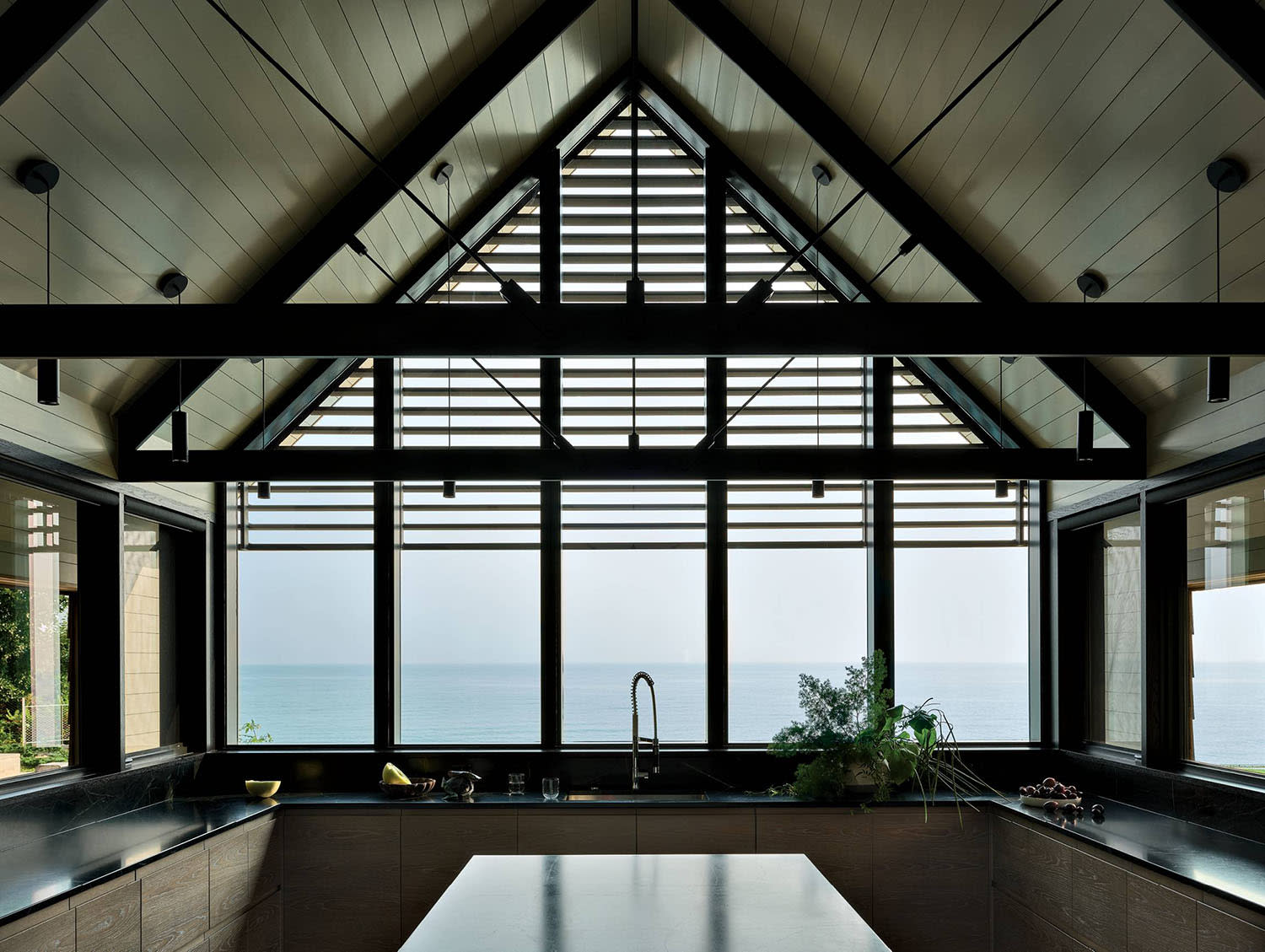 A-frame kitchen with black soapstone countertops and lake views