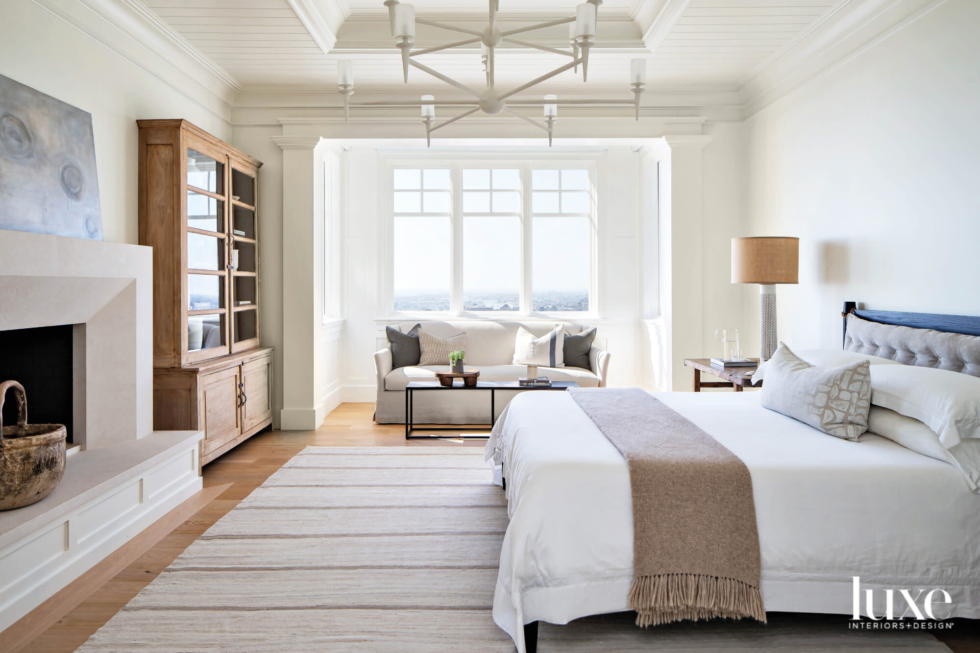 Main bedroom facing bed and built in window seat