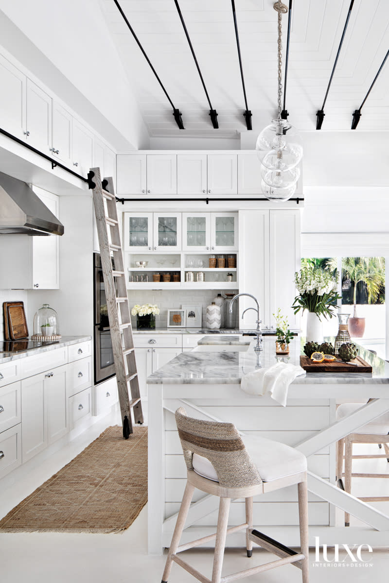 white kitchen with black ceiling tension rods