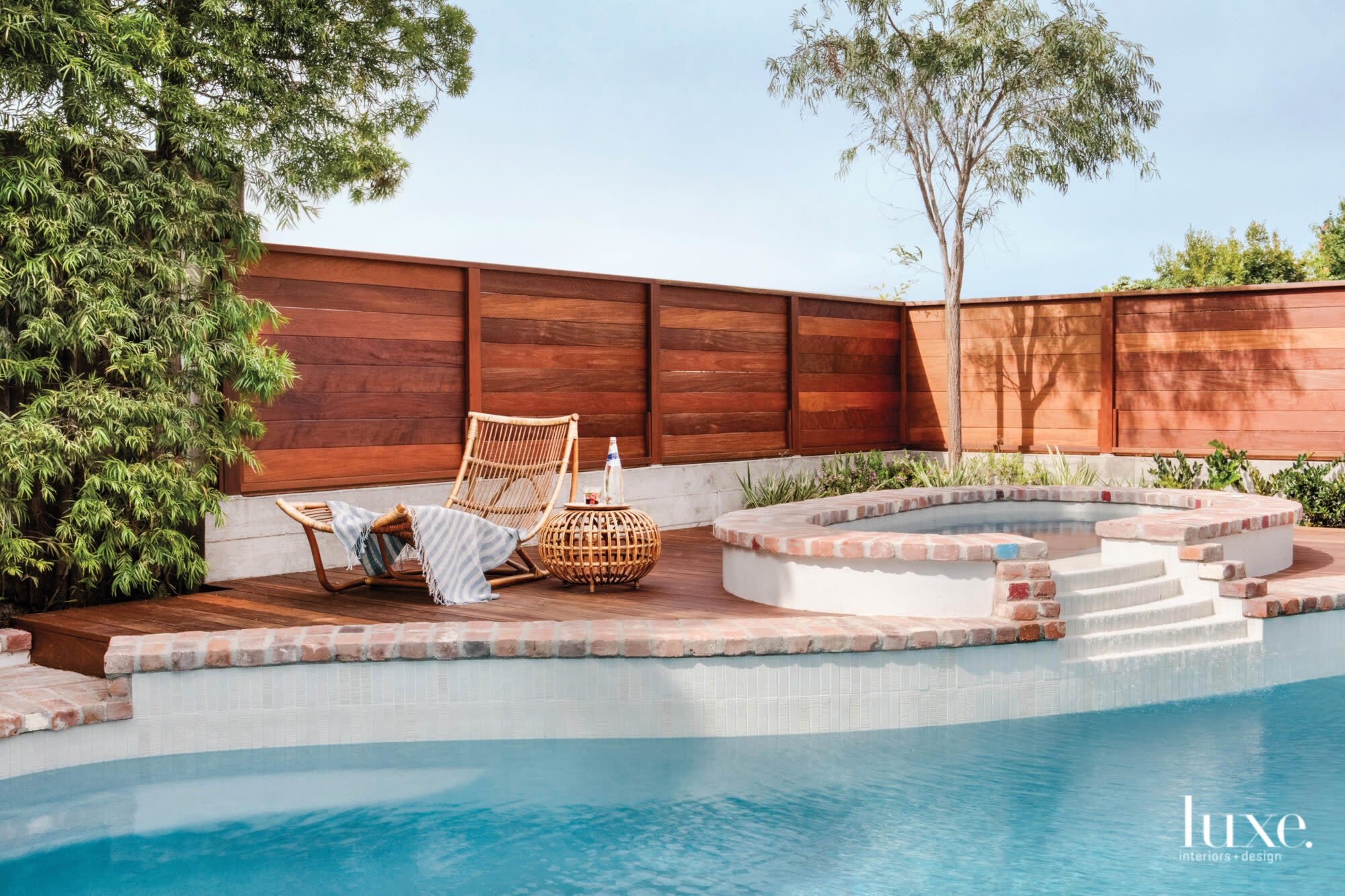View of pool, spa and fence