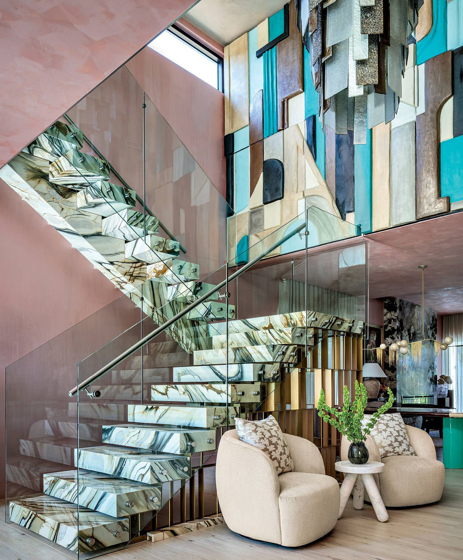 pink Venetian plaster walls surround a staricase in a maximalist Miami home