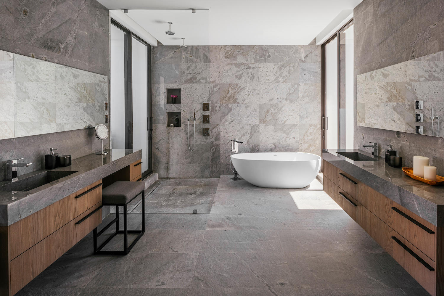 bathroom with large format tile and freestanding tub