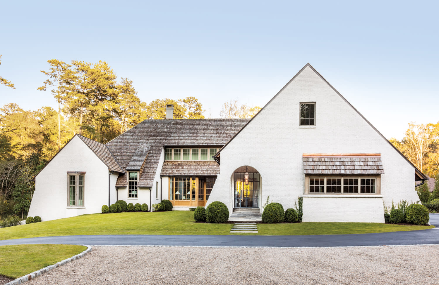 Belgian-influenced residence surrounded by verdant landscaping