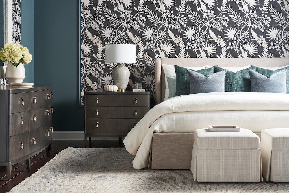 Bedroom with black and white floral wallpaper, creating a serene and elegant atmosphere.