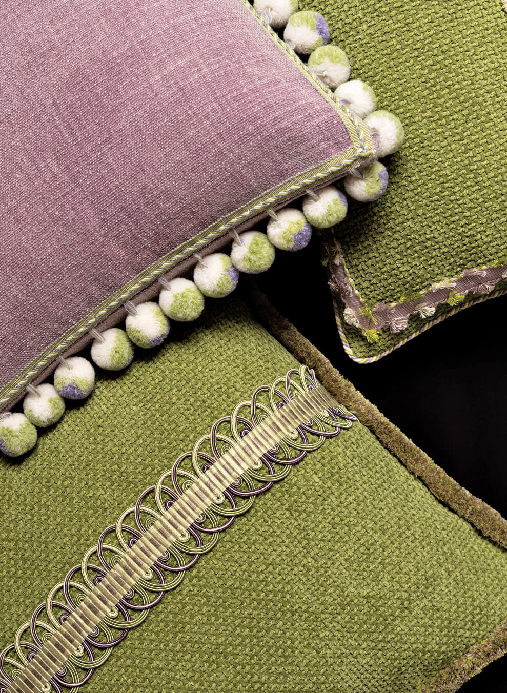 purple and green throw pillows with delicate trim
