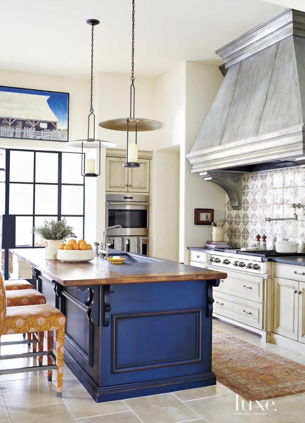 blue cabinet in white kitchen