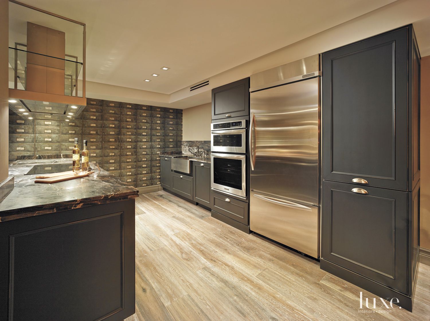 sleek kitchen with black cabinetry