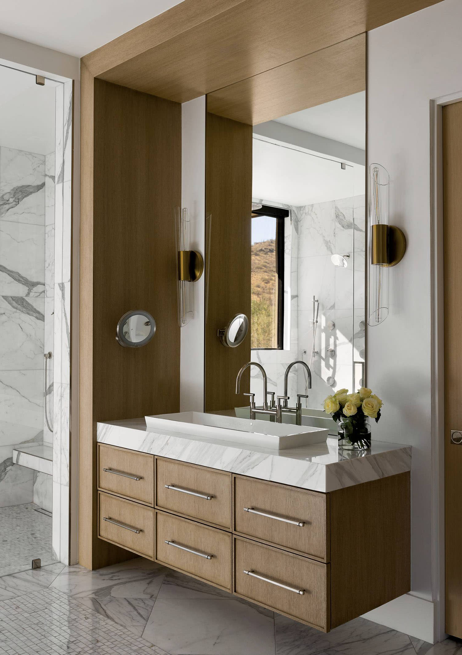 modern bathroom with a Calacatta marble-topped vanity