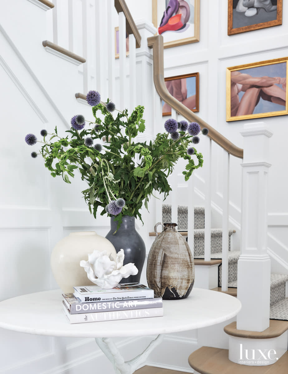 entry table with vases near staircase