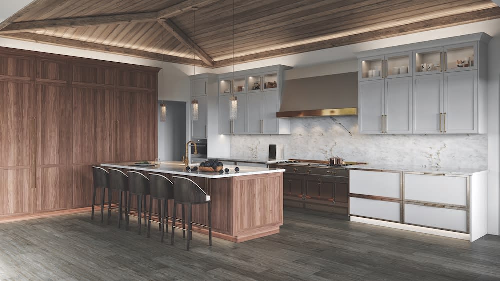 open kitchen with white cabinets, large island and wood ceiling in Southern California home by Coastal Home Design Studio