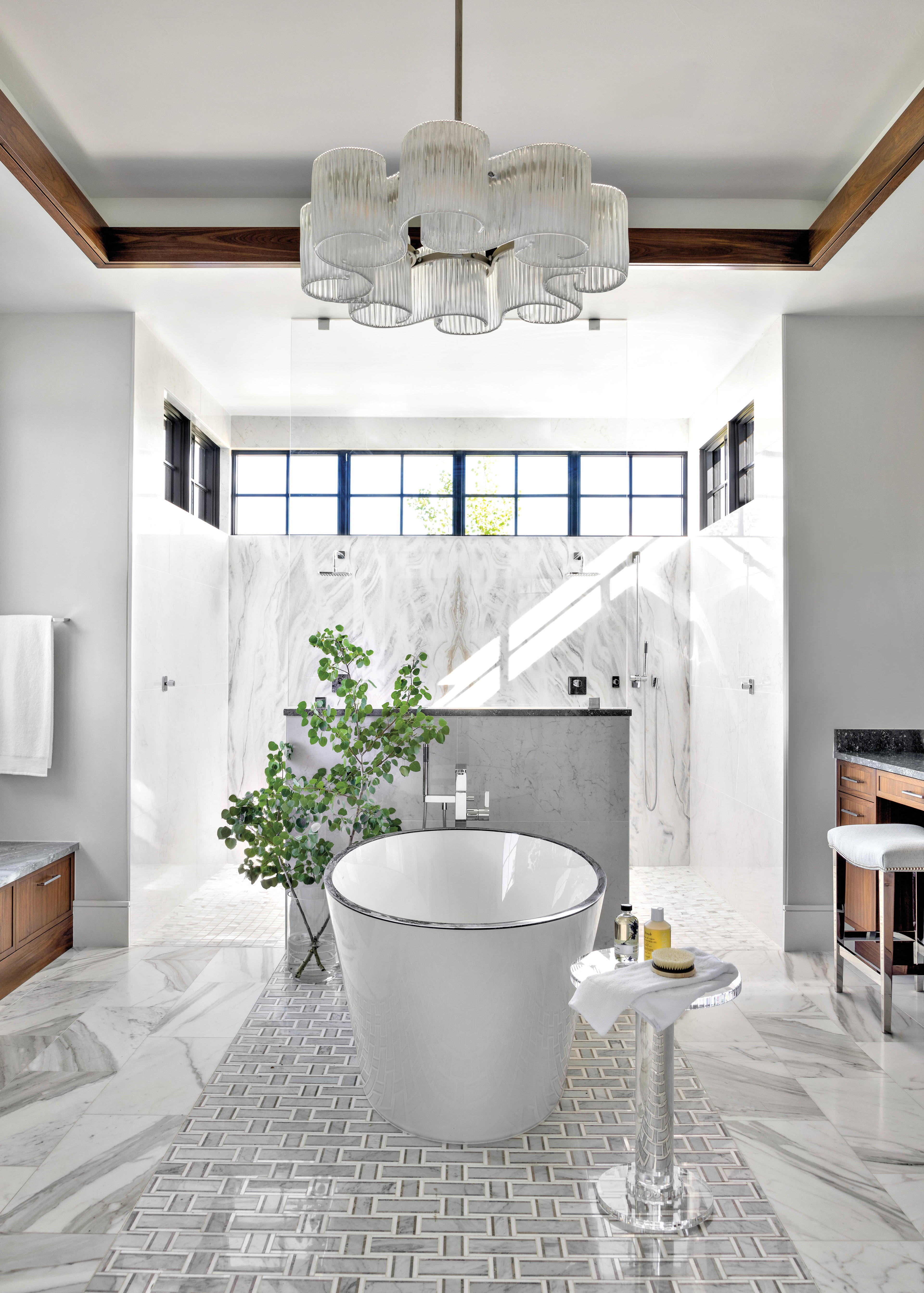 luxurious and bright bathroom with white marble finishes