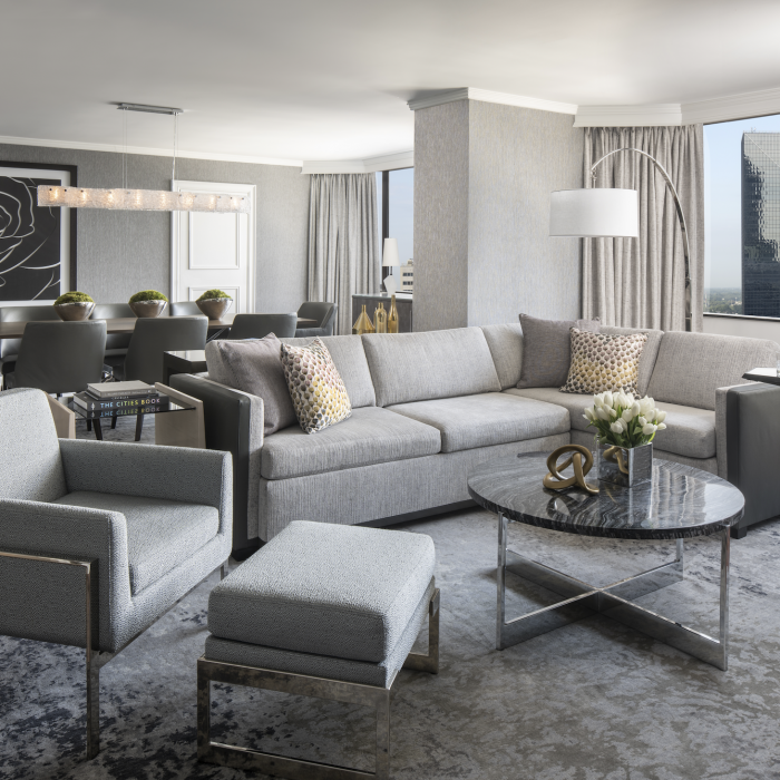 Spacious accommodations and skyline views welcome guests into the Ritz-Carlton Suite.