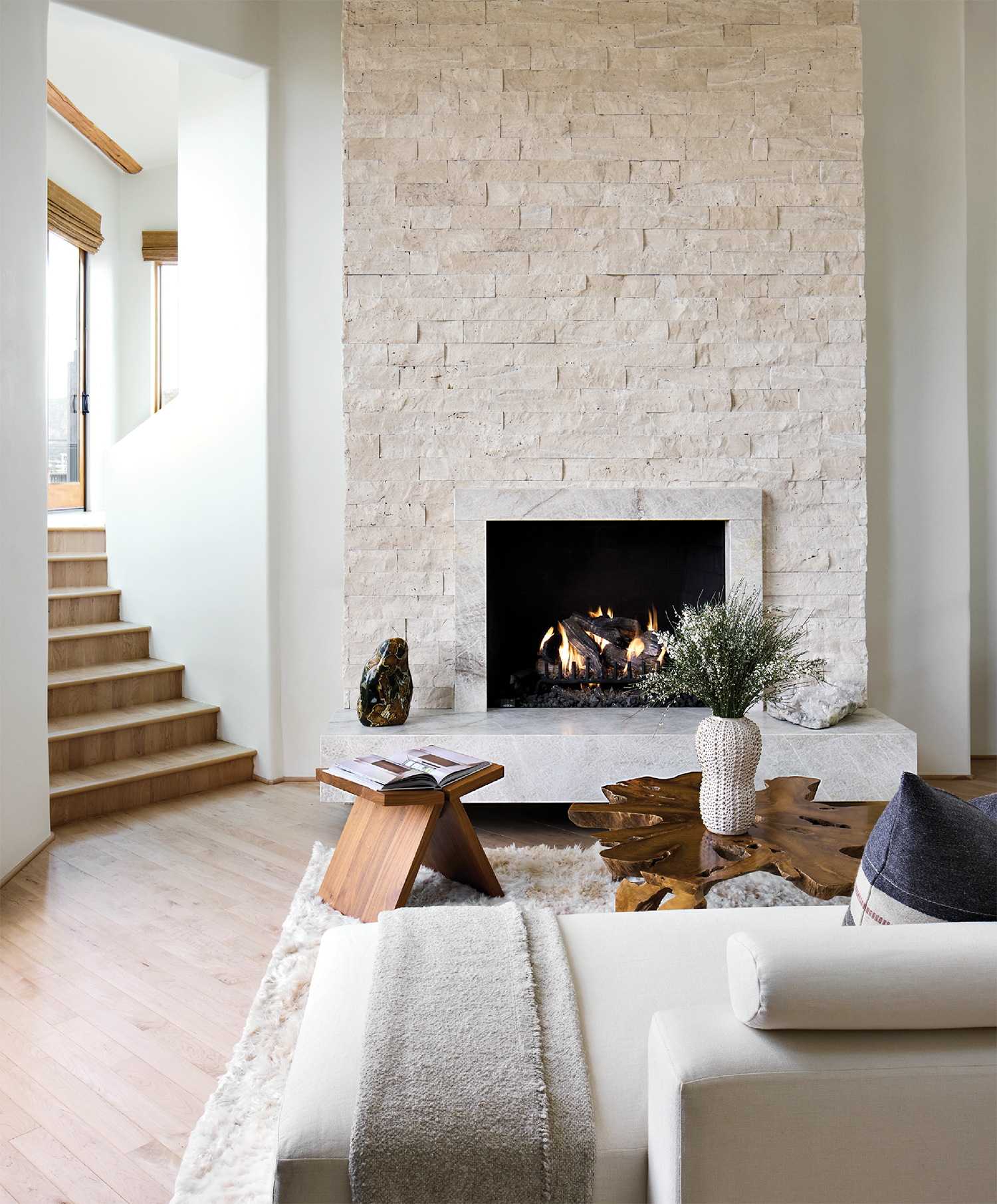living room with a split-face limestone surround and Taj Mahal quartzite hearth 
