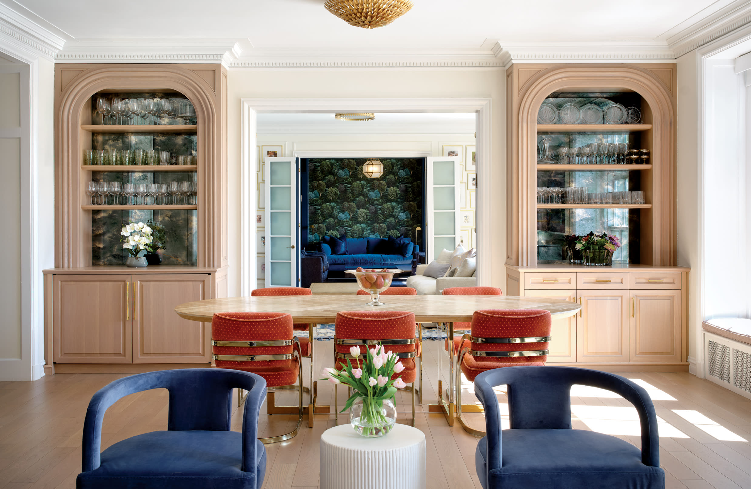 dining area with red and white polka dot chairs and an oval ModShop table in a vintage home