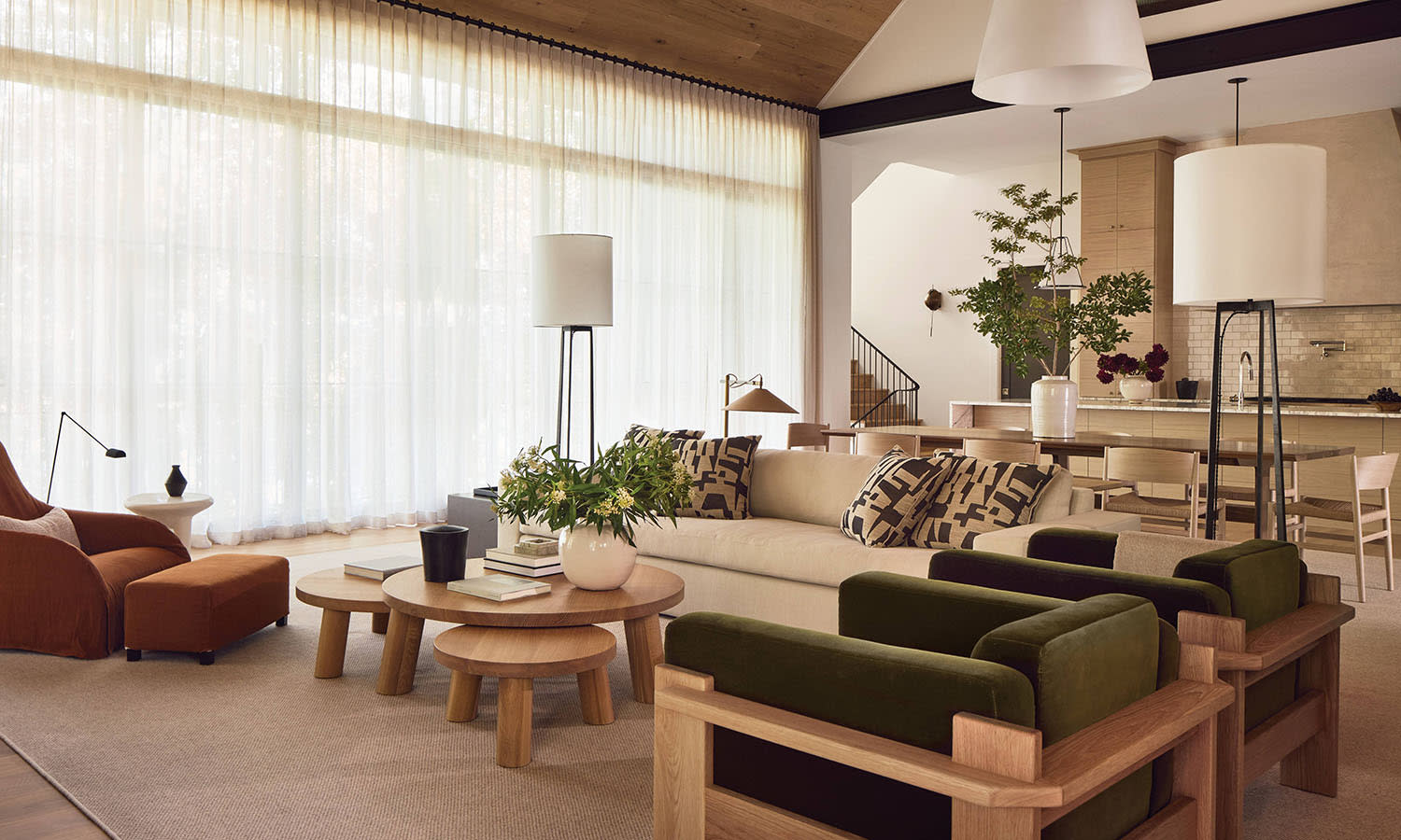 contemporary great room with sheer curtains and warm tone furnishings