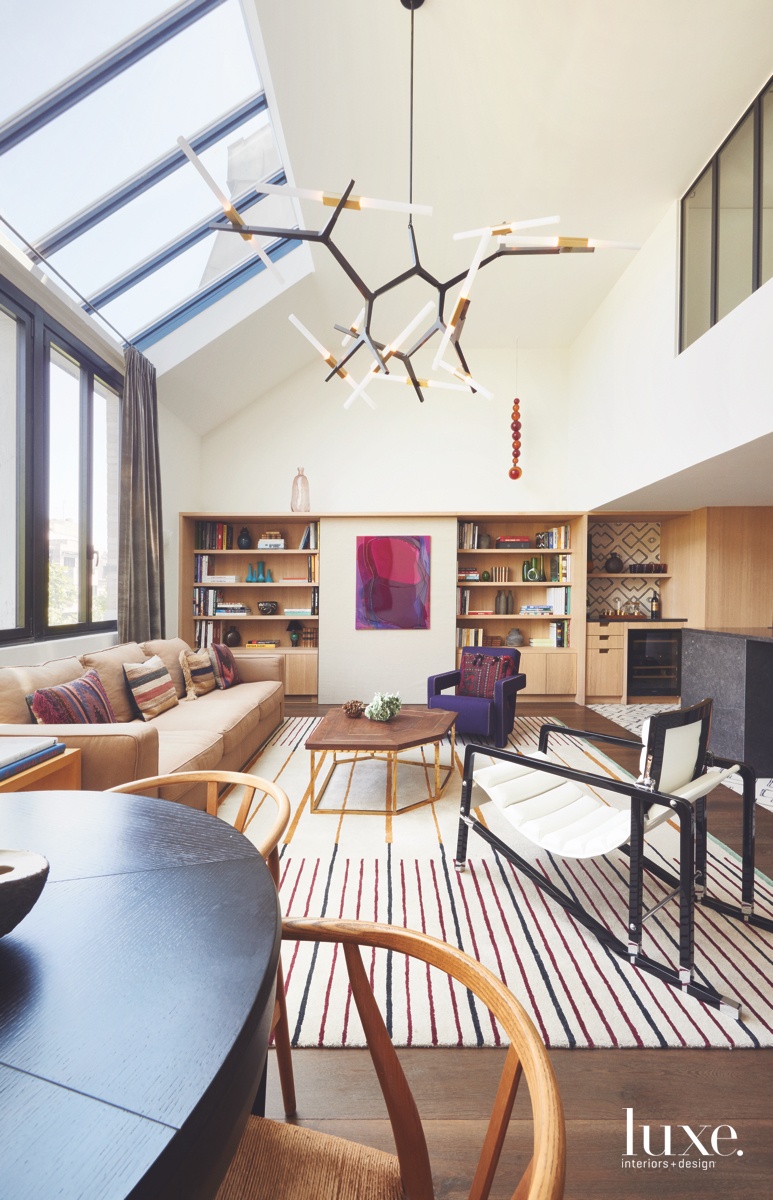 A Parisian apartment by Commune Design channels sunny California though American furnishings and art.