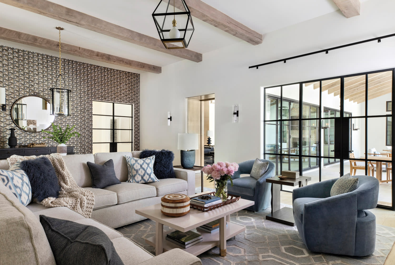 family room with oak beams and a taupe sectional