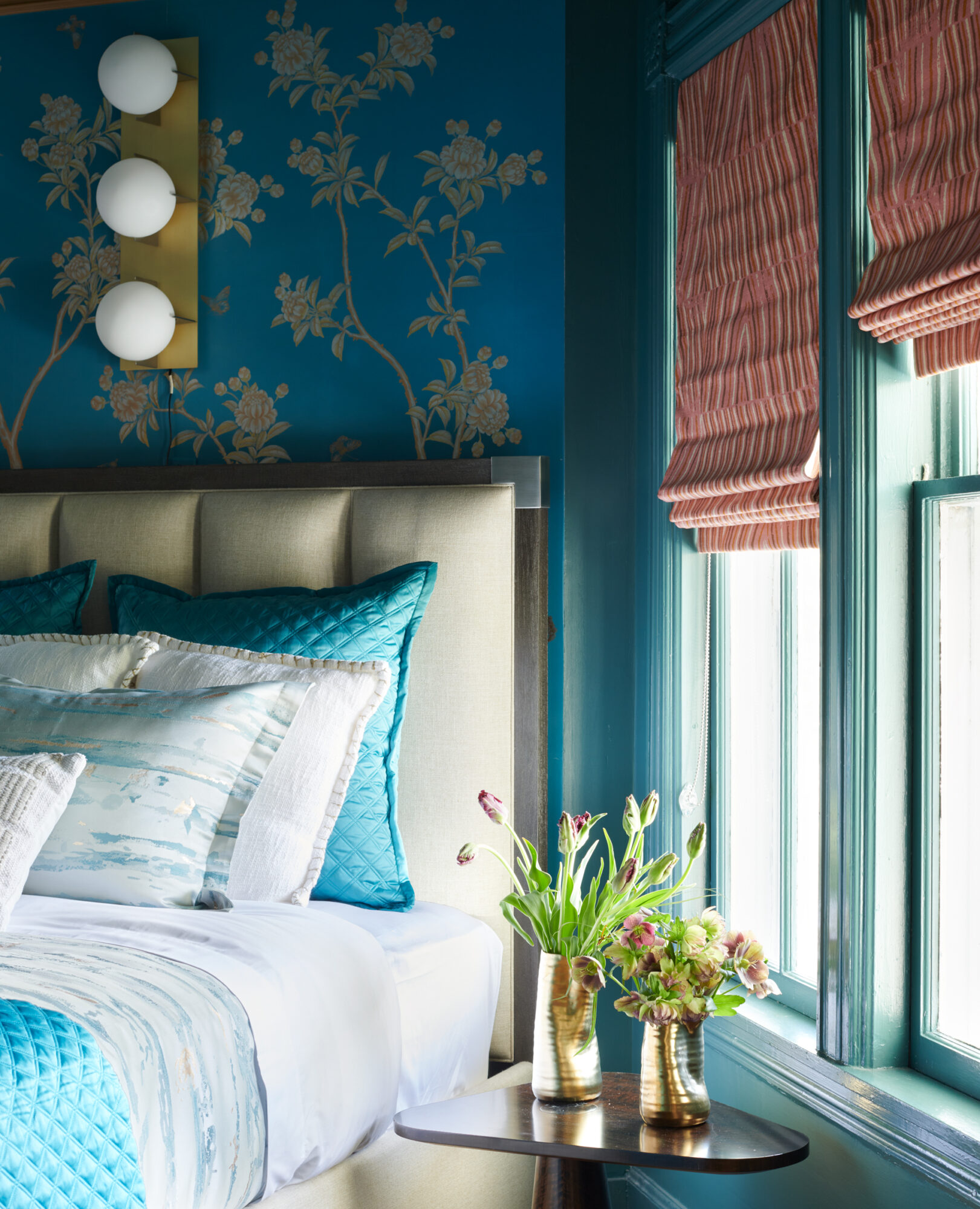 blue floral bedroom with orange shades