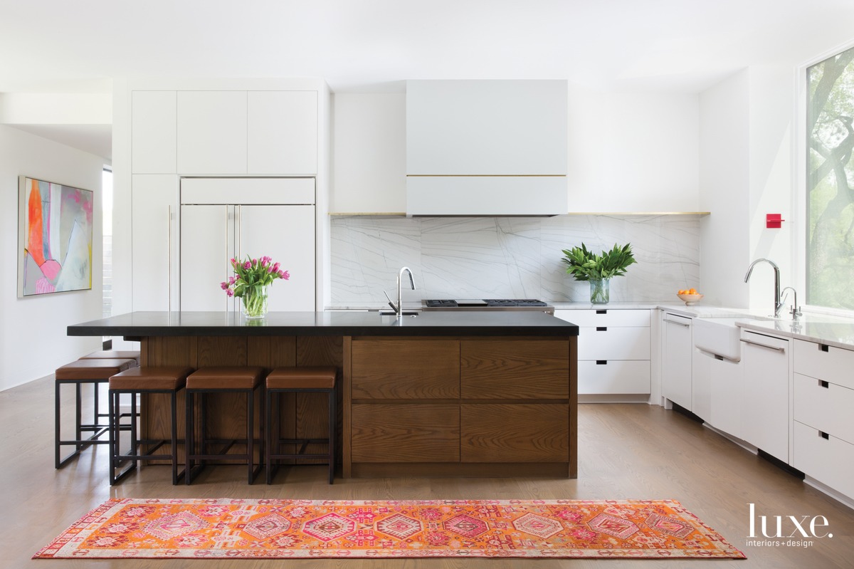 eclectic white kitchen brown island and counter stools