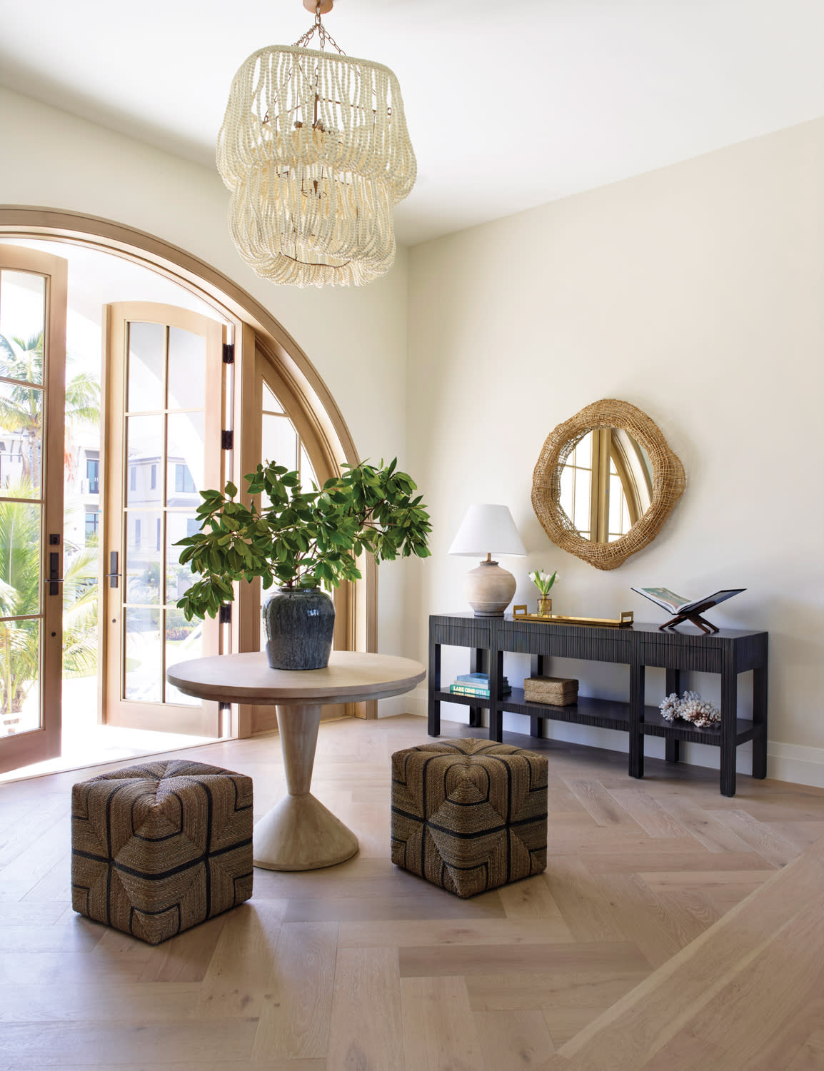 elegant entryway of a Florida home with an arched doorway
