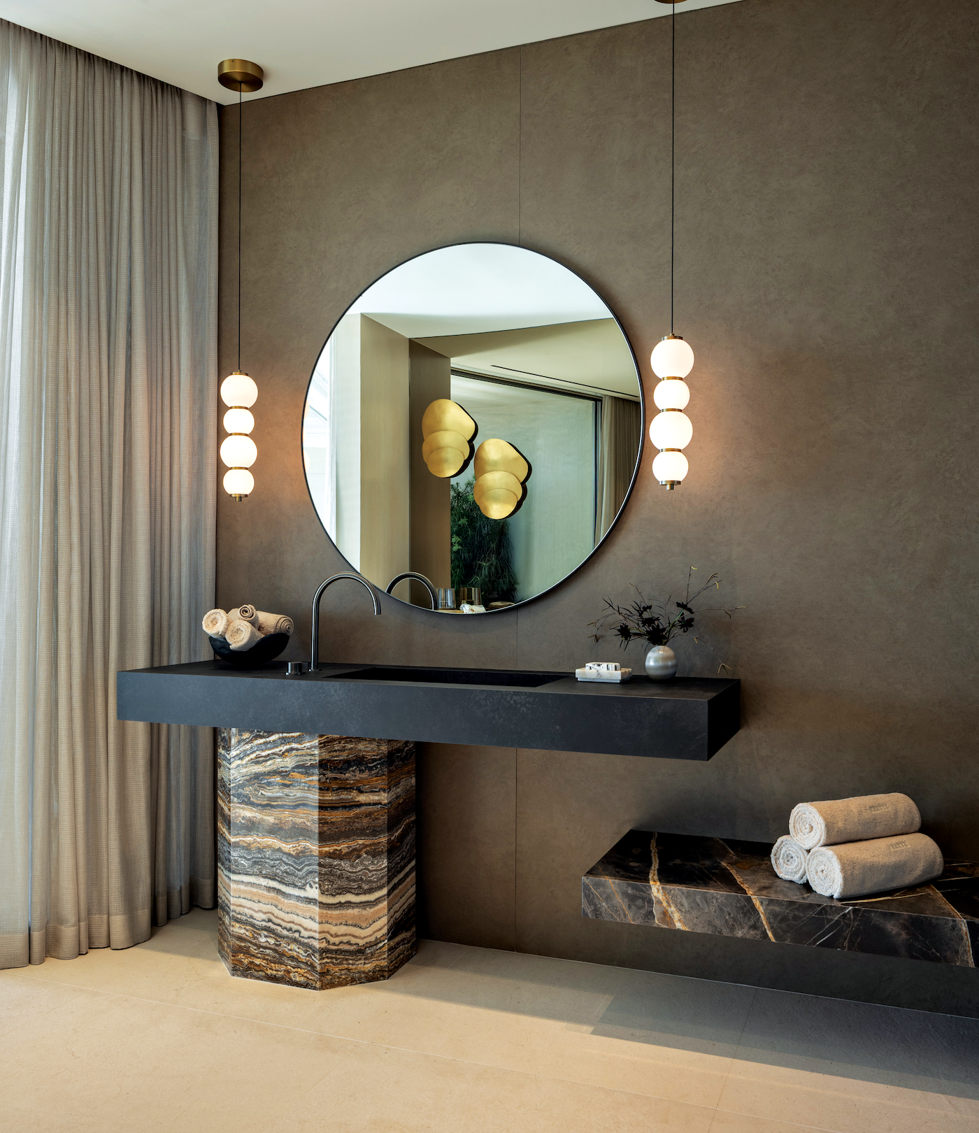 Bathrooms and closets featuring high-end marble surfaces and custom stone installations.