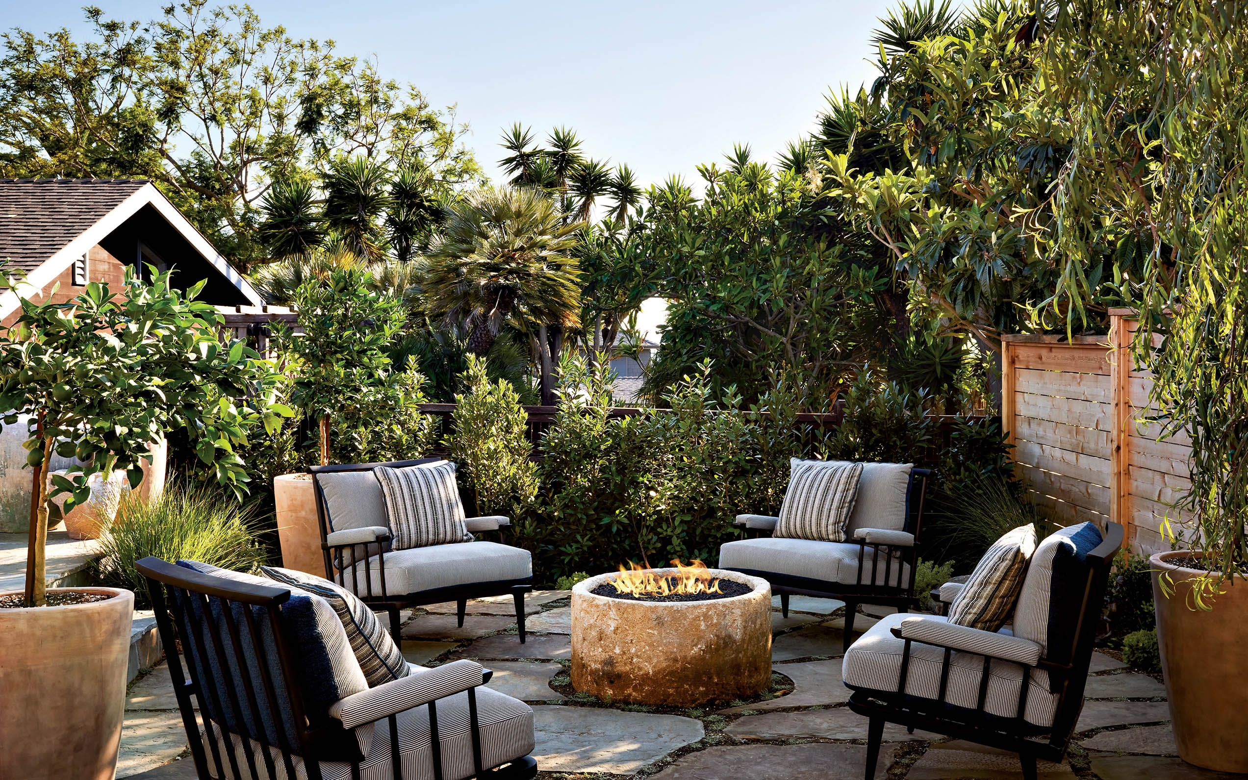 aged fire pit with chairs lined with Zac+Fox outdoor fabric  