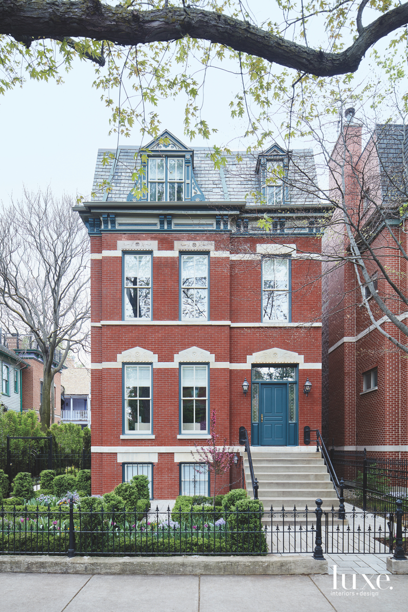 contemporary red brick exterior entry blue door Chicago Victorian