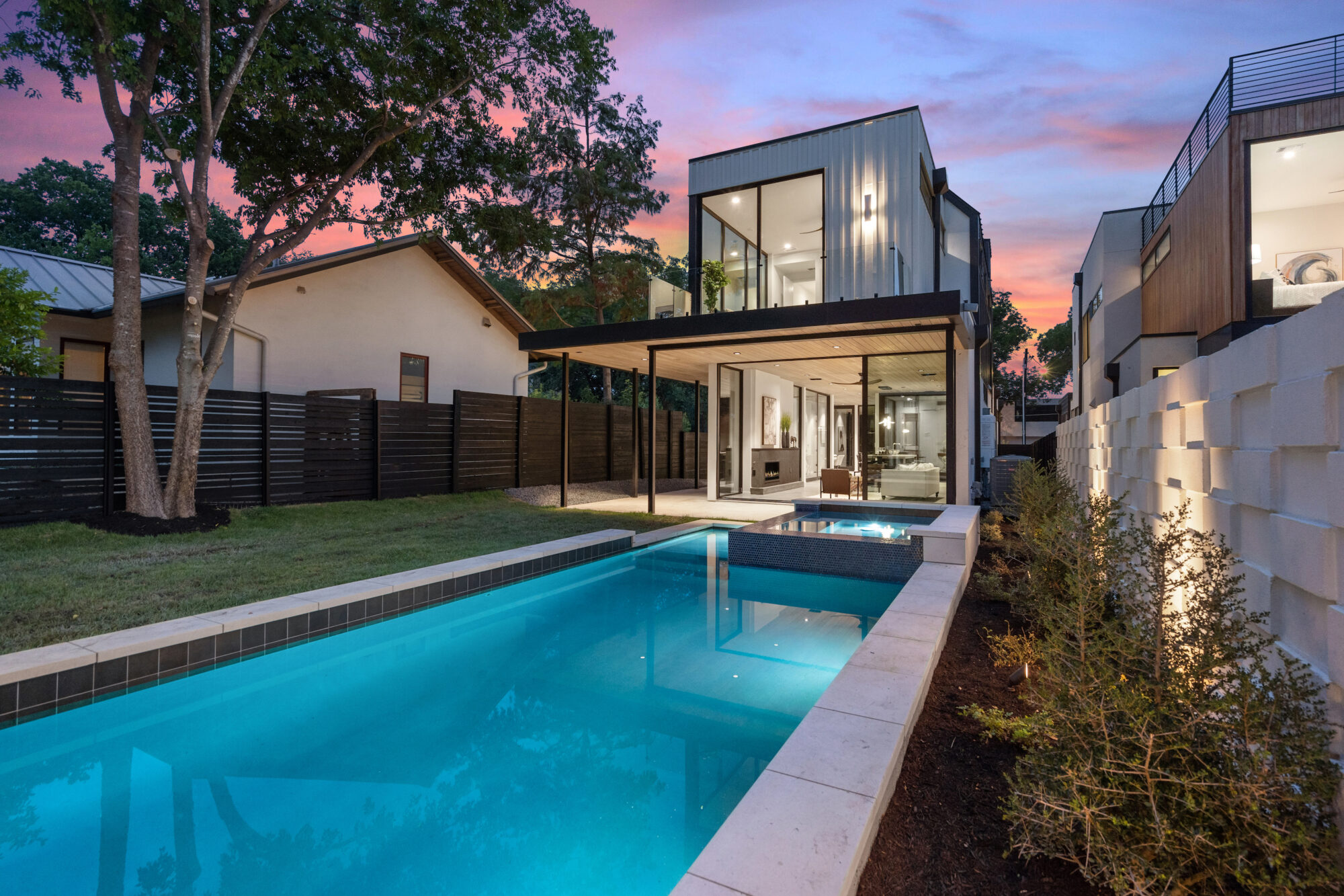 A contemporary house with a pool and deck, offering a perfect blend of style and relaxation.