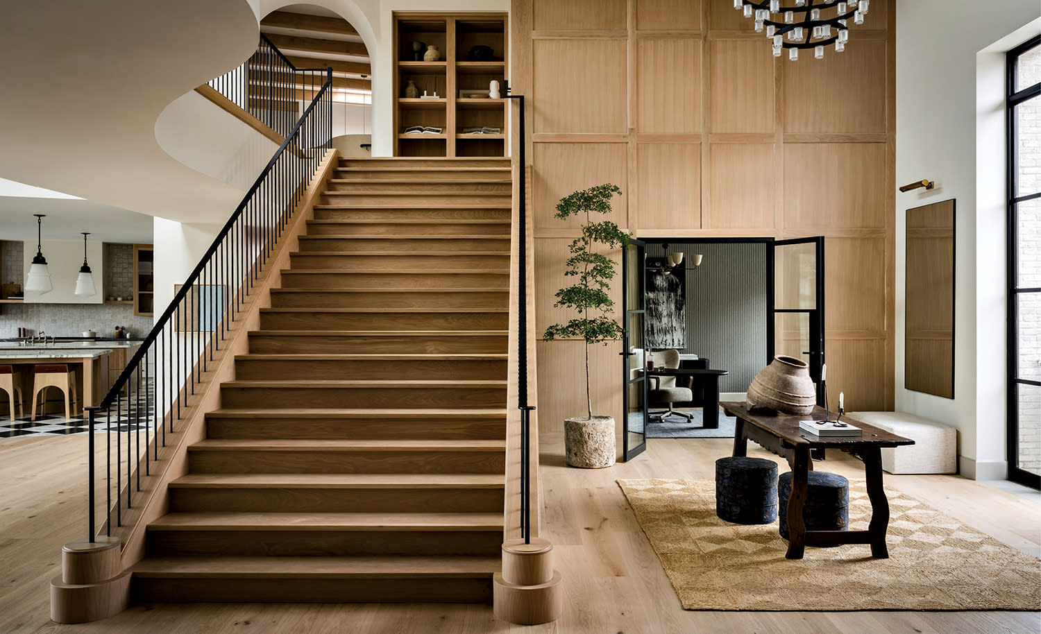interior of a Spanish-style home with statement stairs