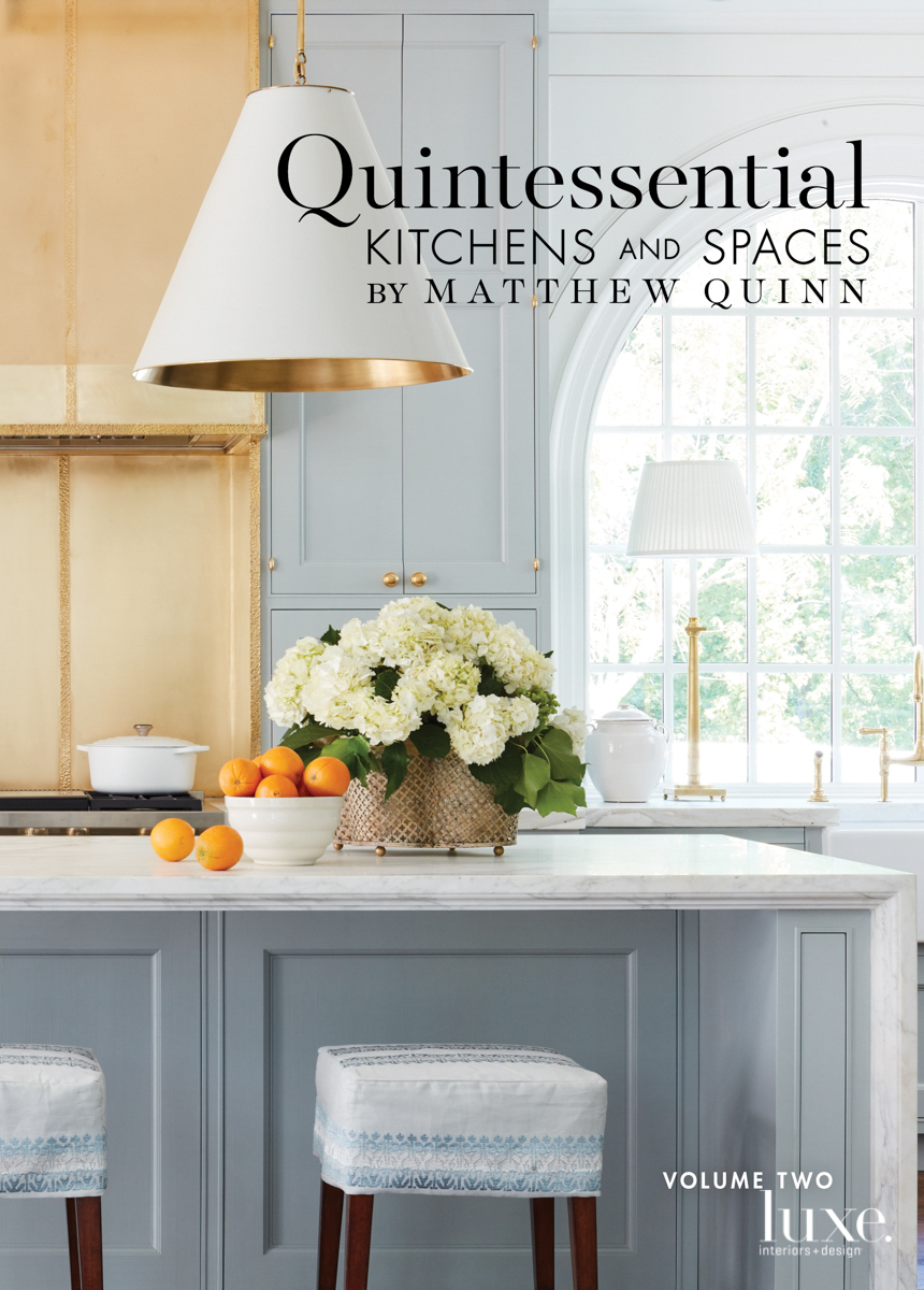 kitchen island with big white and gold chandelier