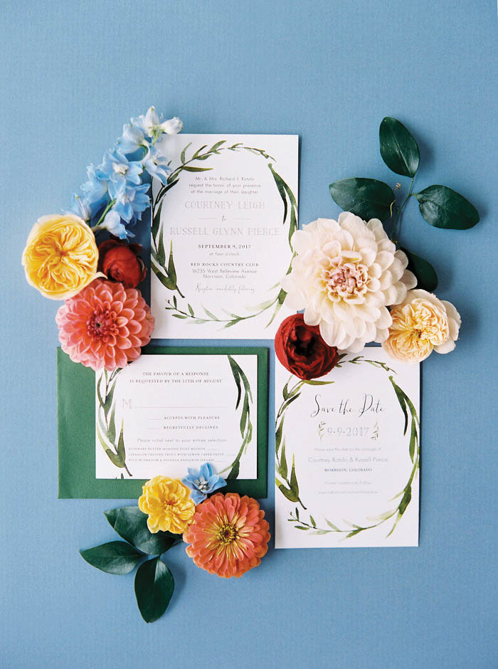 wedding invitations with flowers surrounding