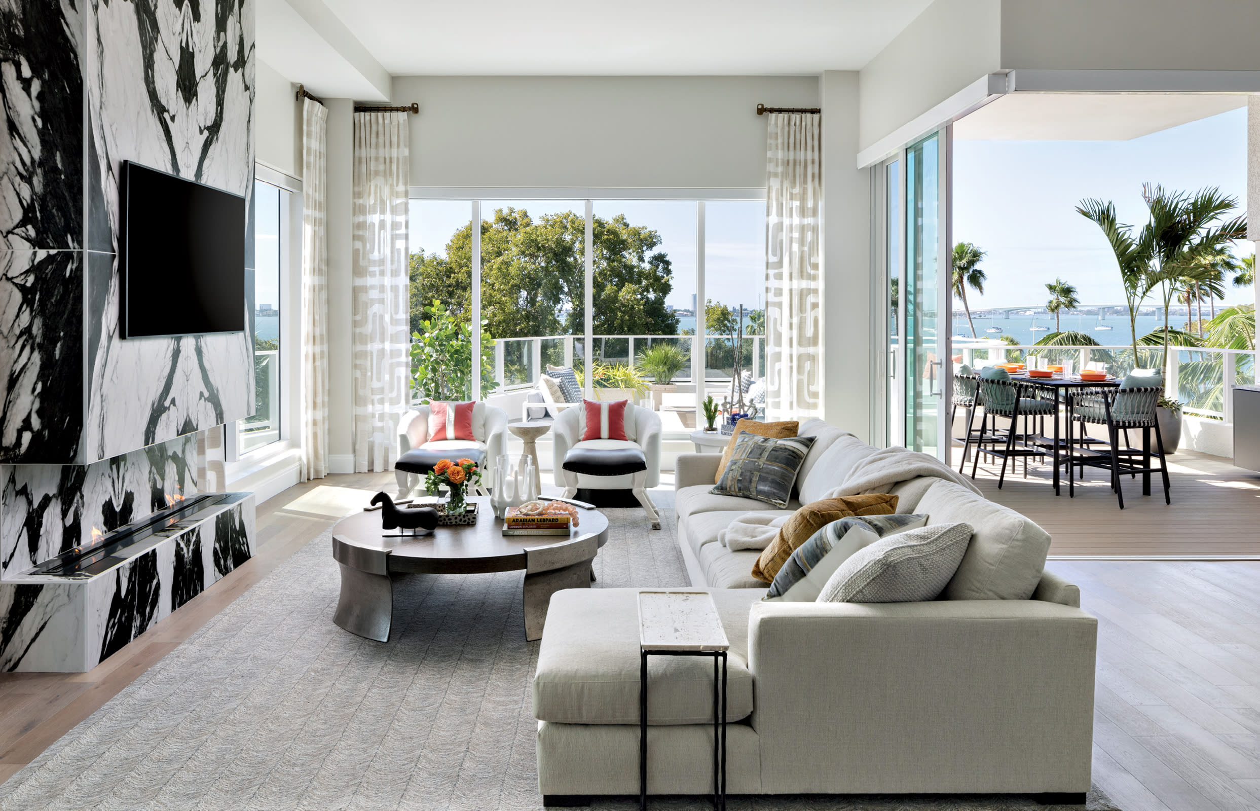 Sarasota living room with a black and white marbled porcelain fireplace wall