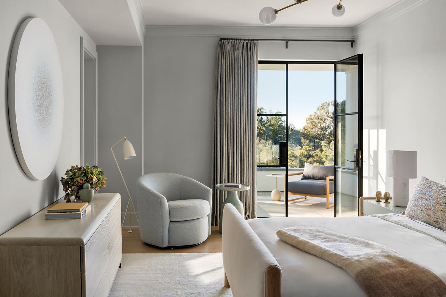 contemporary gray bedroom with cotton linens on the bed