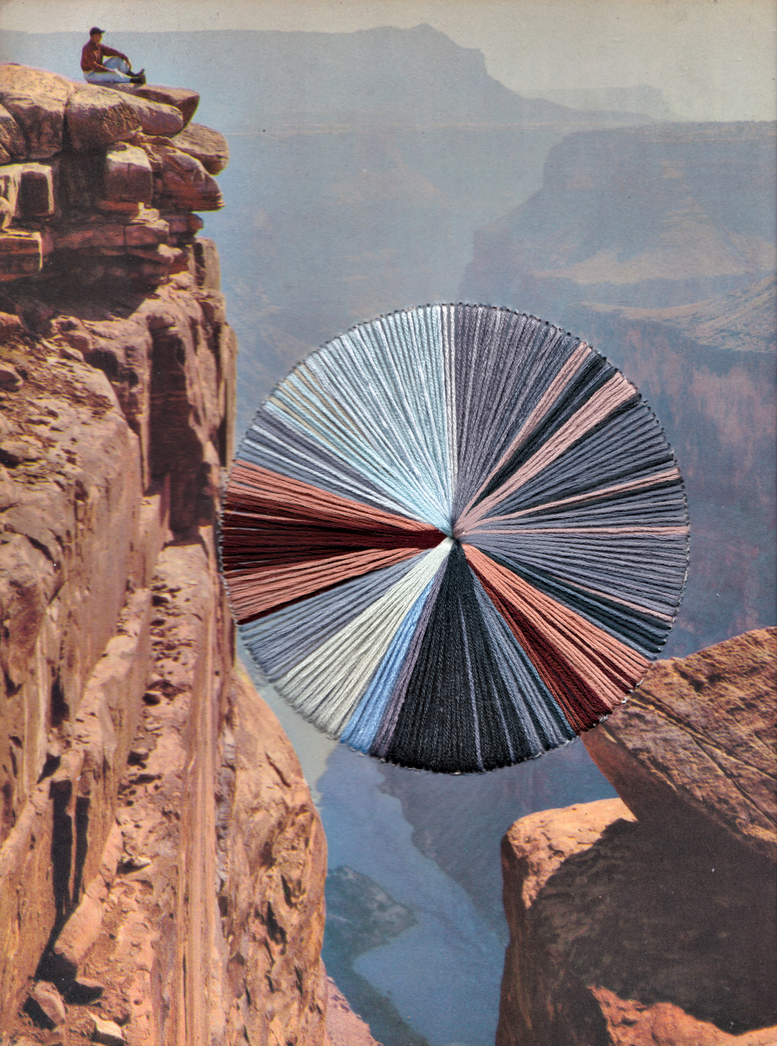 circle of fibers mimicking the colors of the mountainous landscape image behind it